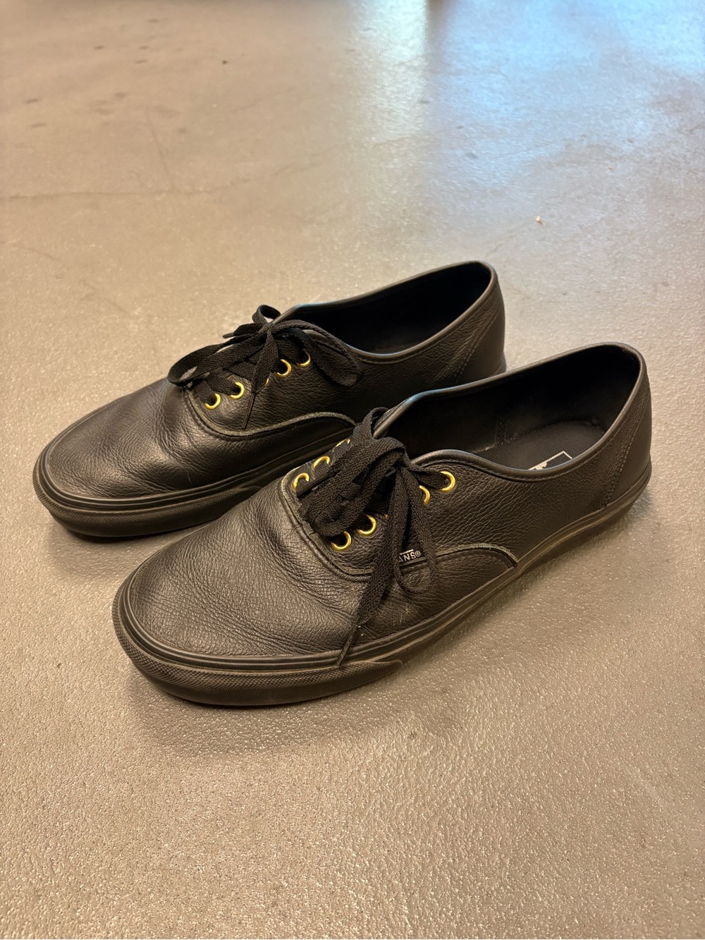 Vans Black Leather Low-Top Sneakers with Gold Eyelets